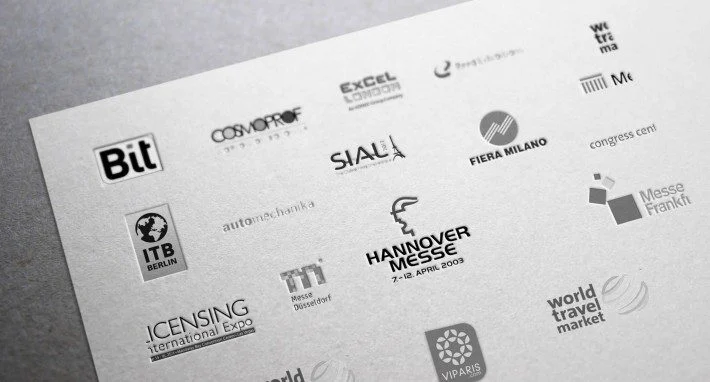 european trade fairs logos in a paper