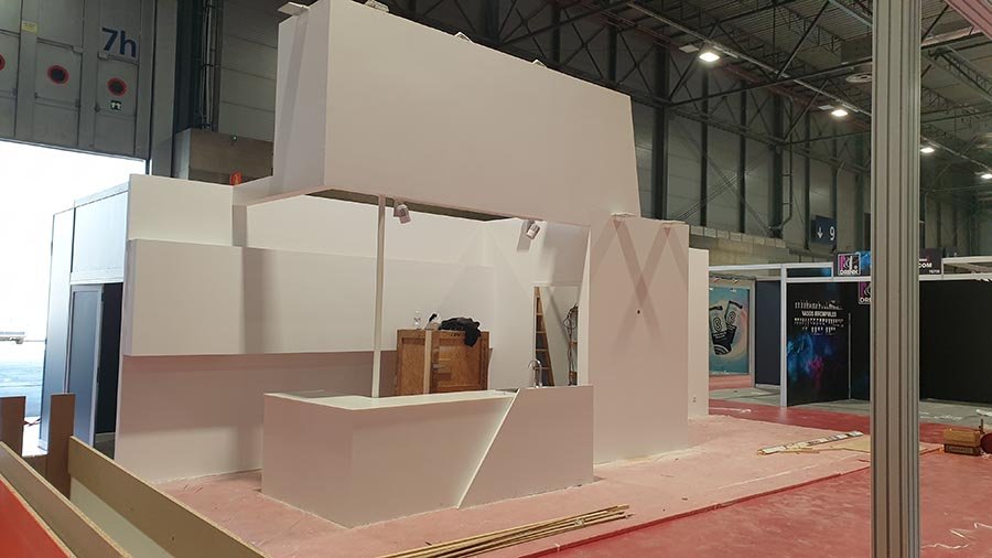 chipboard exhibition booth painted white with no graphics