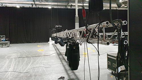truss structure suspended by rigging in trade show