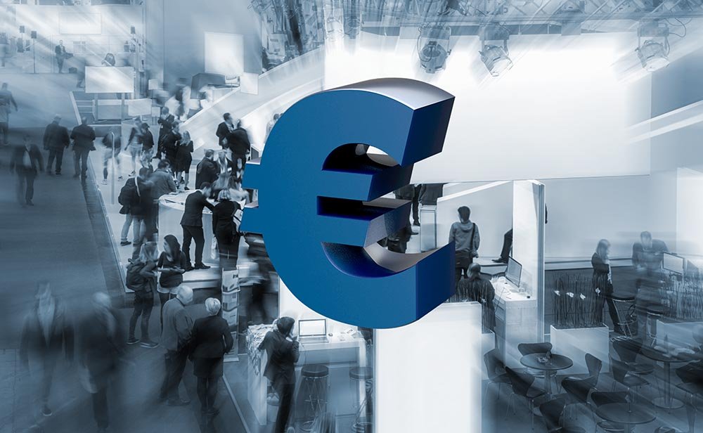 euro symbol over a trade show blue tinted background